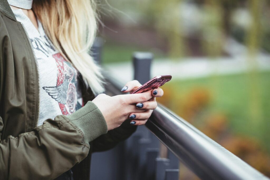 woman holding red phone Lada 722