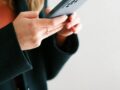 como registrar mi linea telcel a woman holding a cell phone in her hands